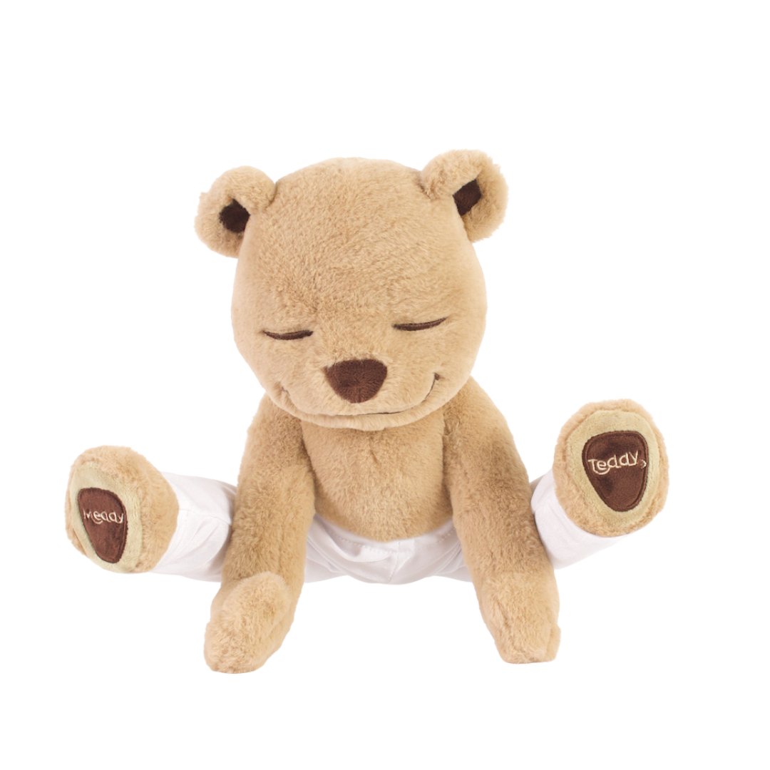 Meddy Teddy Original Yoga Teddy Bear, eyes closed, wearing a white yoga pants, which features a flexible internal frame that allows it to pose in various yoga and meditation positions.